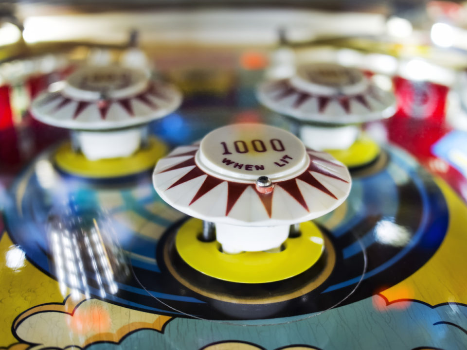 Antique Pinball Machine with Ball in motion